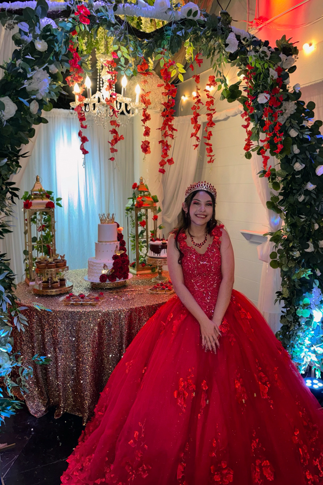 Quinceañera girl wwith mother about to cut cake during a Sweet Sixteen reception