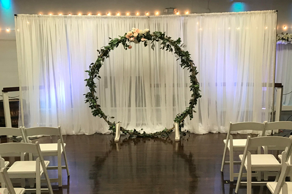 Decorated Moon Arch with greenery & floral