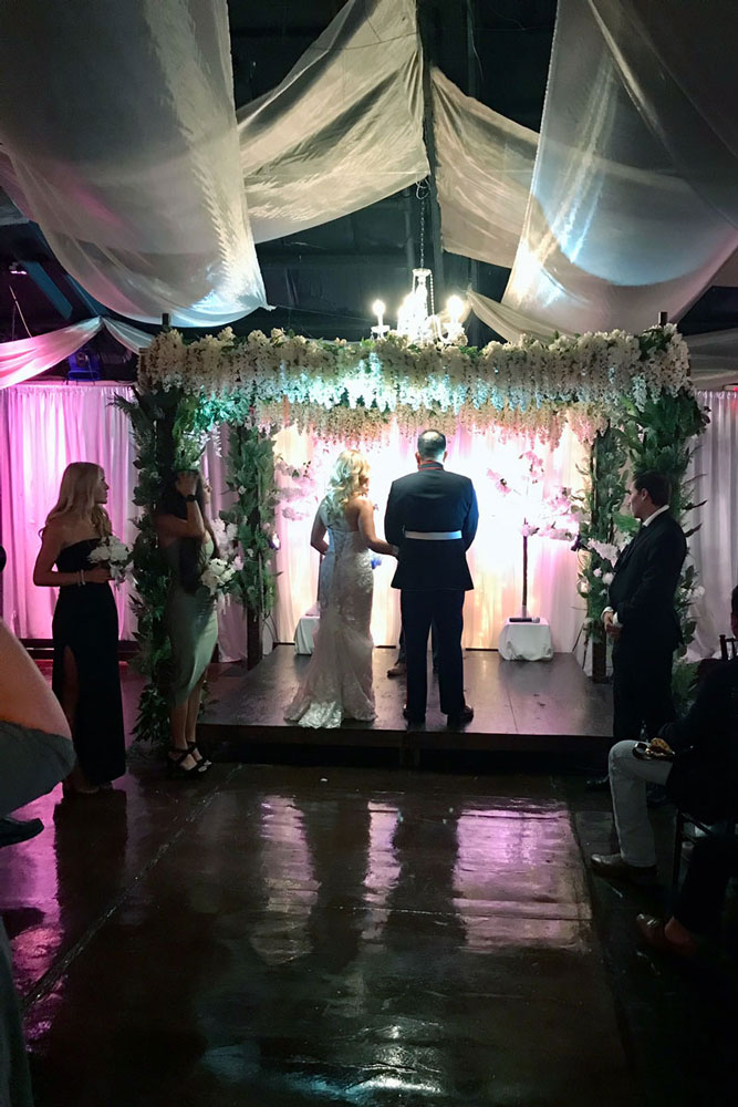 wedding ceremony with coouple saying their vows