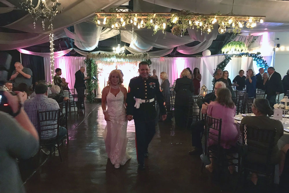 wedding couple exits the ceremony stage