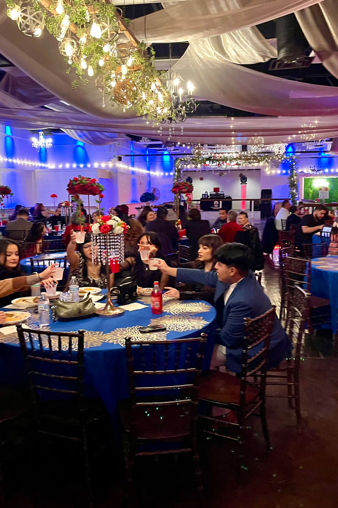 Main hall with guests celebrating and toasting