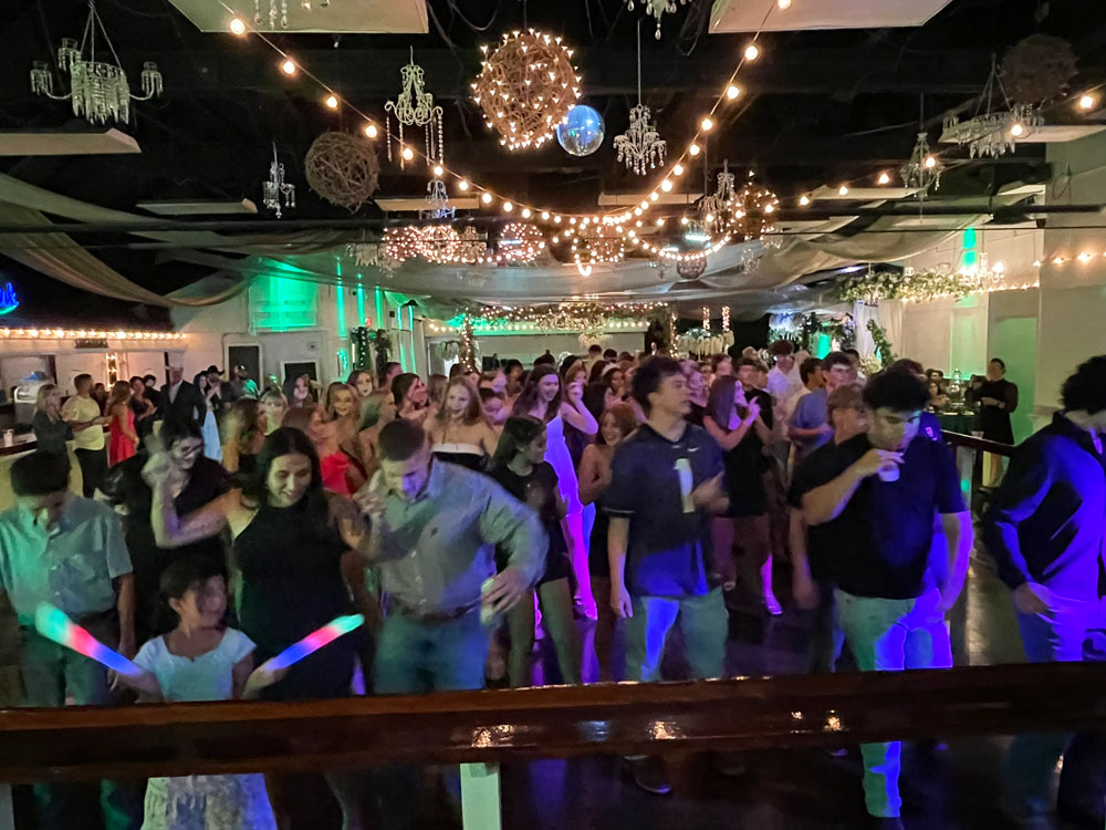 Ballroom dance floor with greenery-inspired lighting design