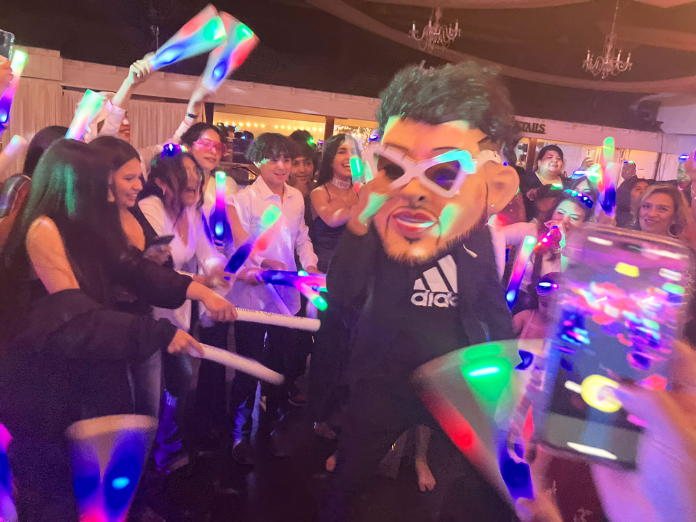 Ballroom dance floor accented with soft violet lighting and dramatic ambiance