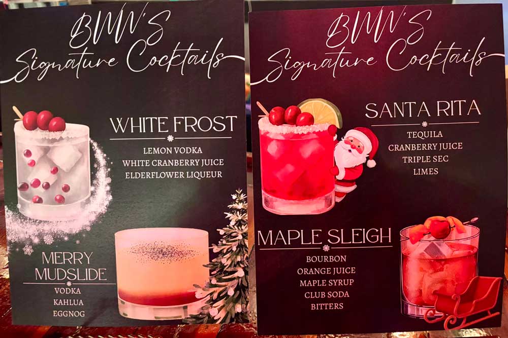 Festive holiday menu board sits atop the bar inviting guests on what drinks to try.