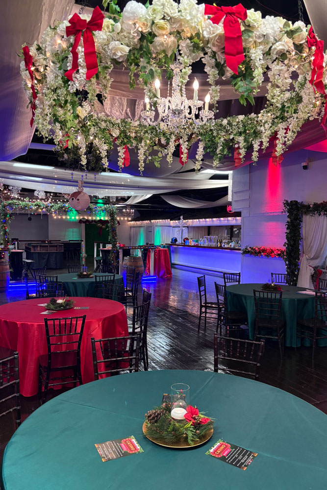 Classic Christmas centerpiece with greenery, candles, and elegant table décor
