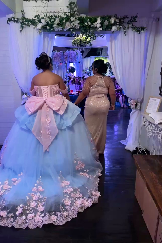 Monther and daughter move toward the entryway for a  grand introduction