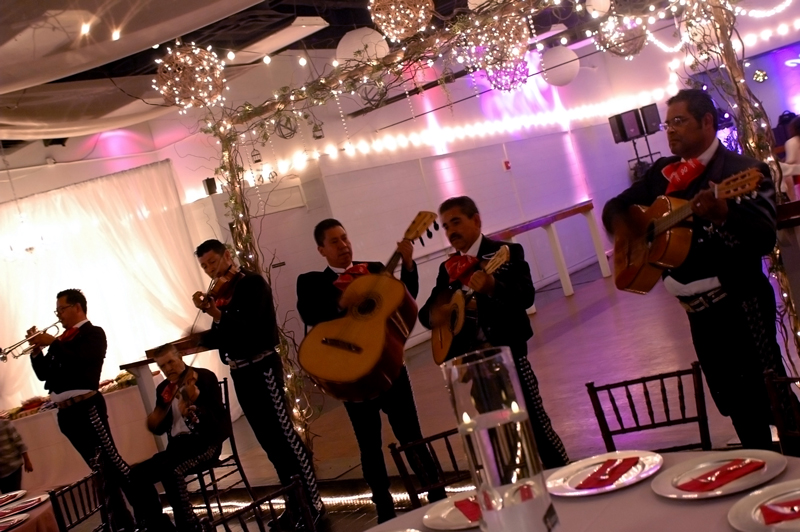Mariachi band serenading the quince girl and her guests.