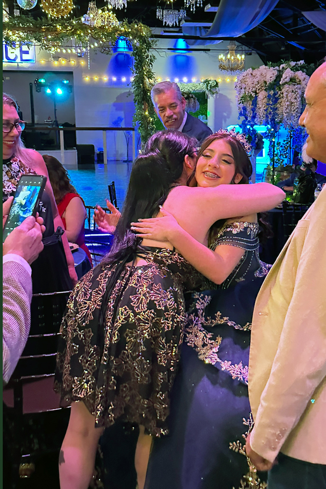 Quinceañera girl that was welcomed with love from a family member.