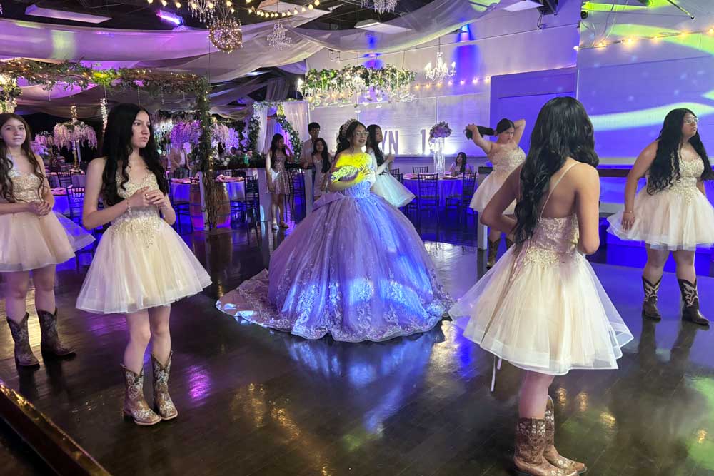Quinceanera court taking an impromtu, fun photo.