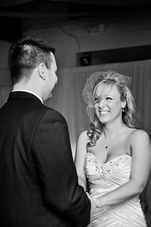 Bride and groom jubilant saying vows.
