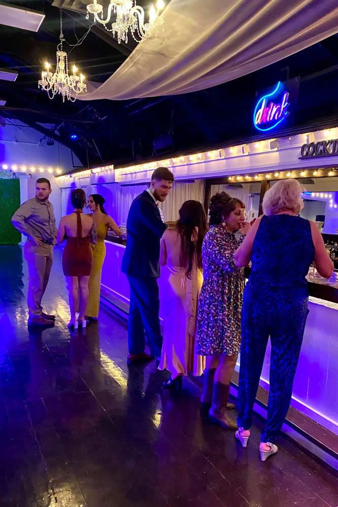 Guests being served at a 30 ft bar.