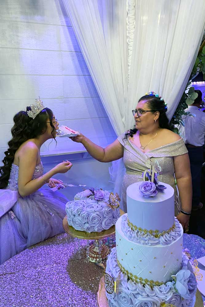 Quinceanera girl wwith friend sees the dance floor come alive.