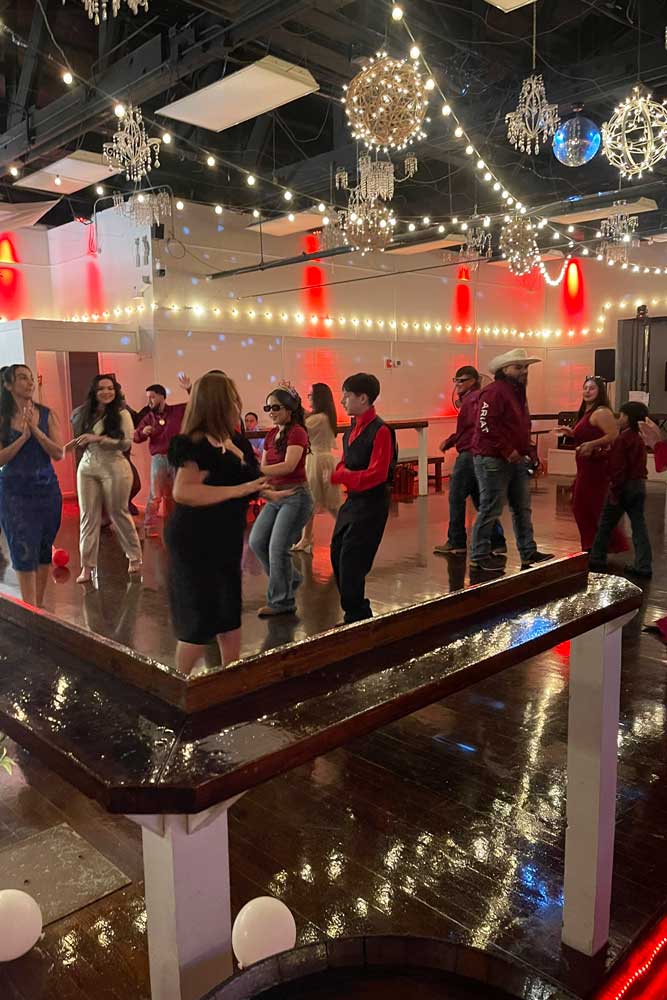 Illuminated dance floor filled with dancers.