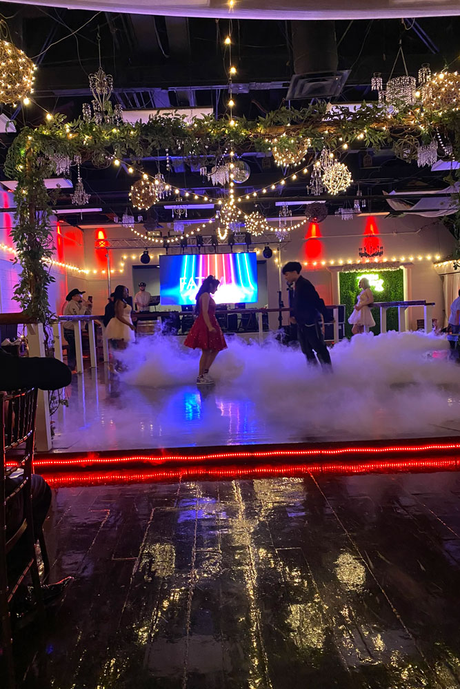 People coming together on the illuminated dance floor