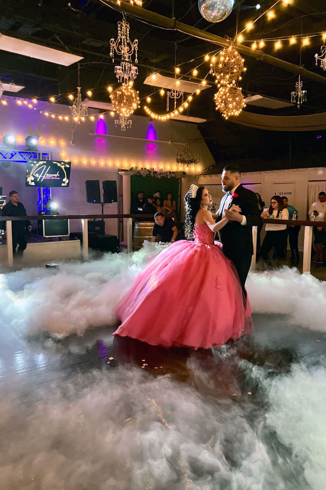 First dance on the ballroom floor with elegant lighting