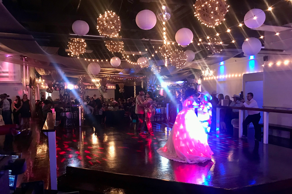 Packed dance floor with guests celebrating together