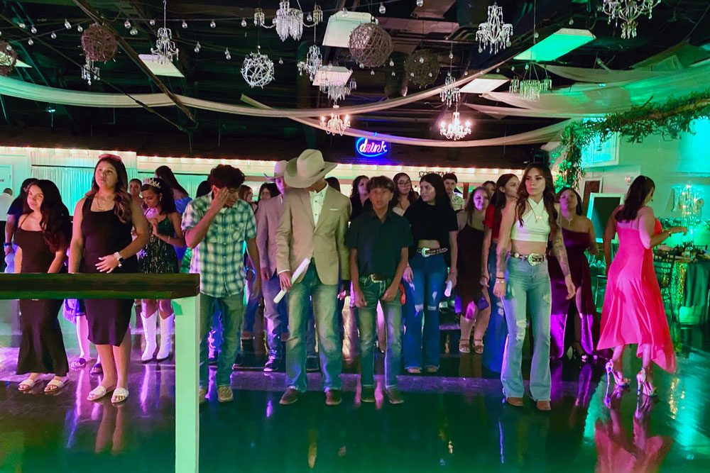 Guests dancing and enjoying a lively celebration on the ballroom floor