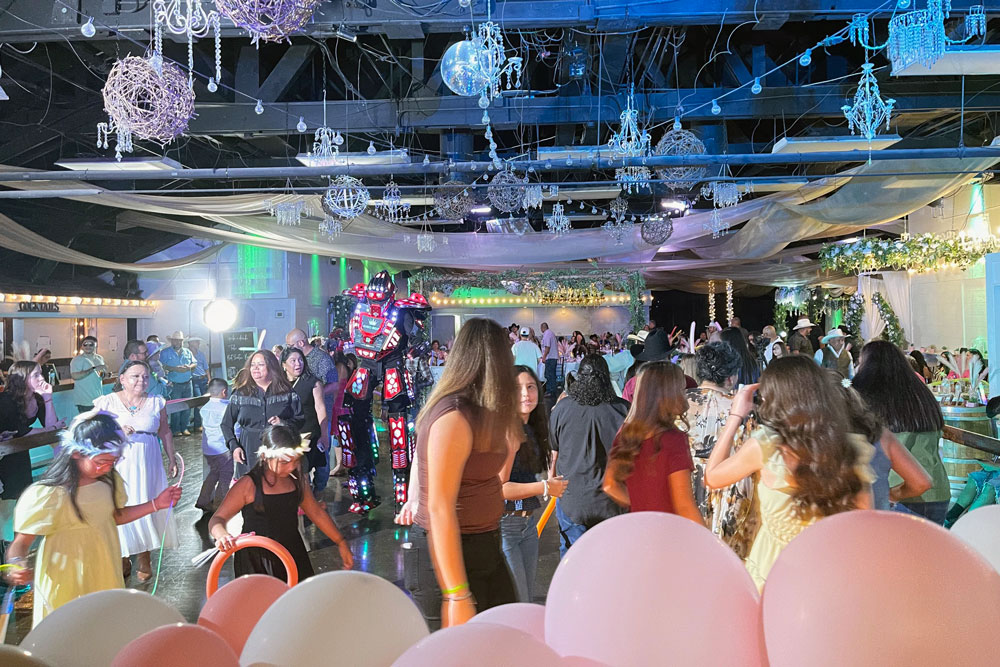 People celebrating together on a packed dance floor