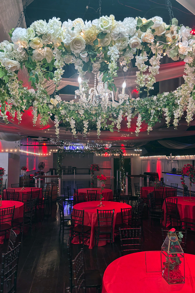 Garden chandelier styled above guest area creating a dramatic focal point
